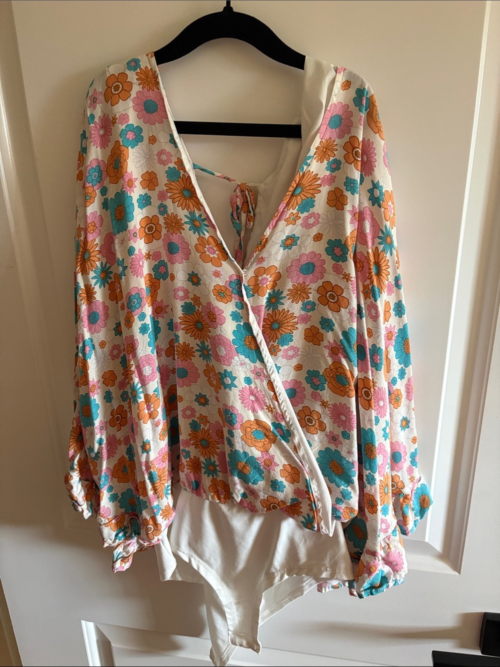 Pink Lily Floral Wrap Bodysuit in White with Pink, Orange & Teal Flowers